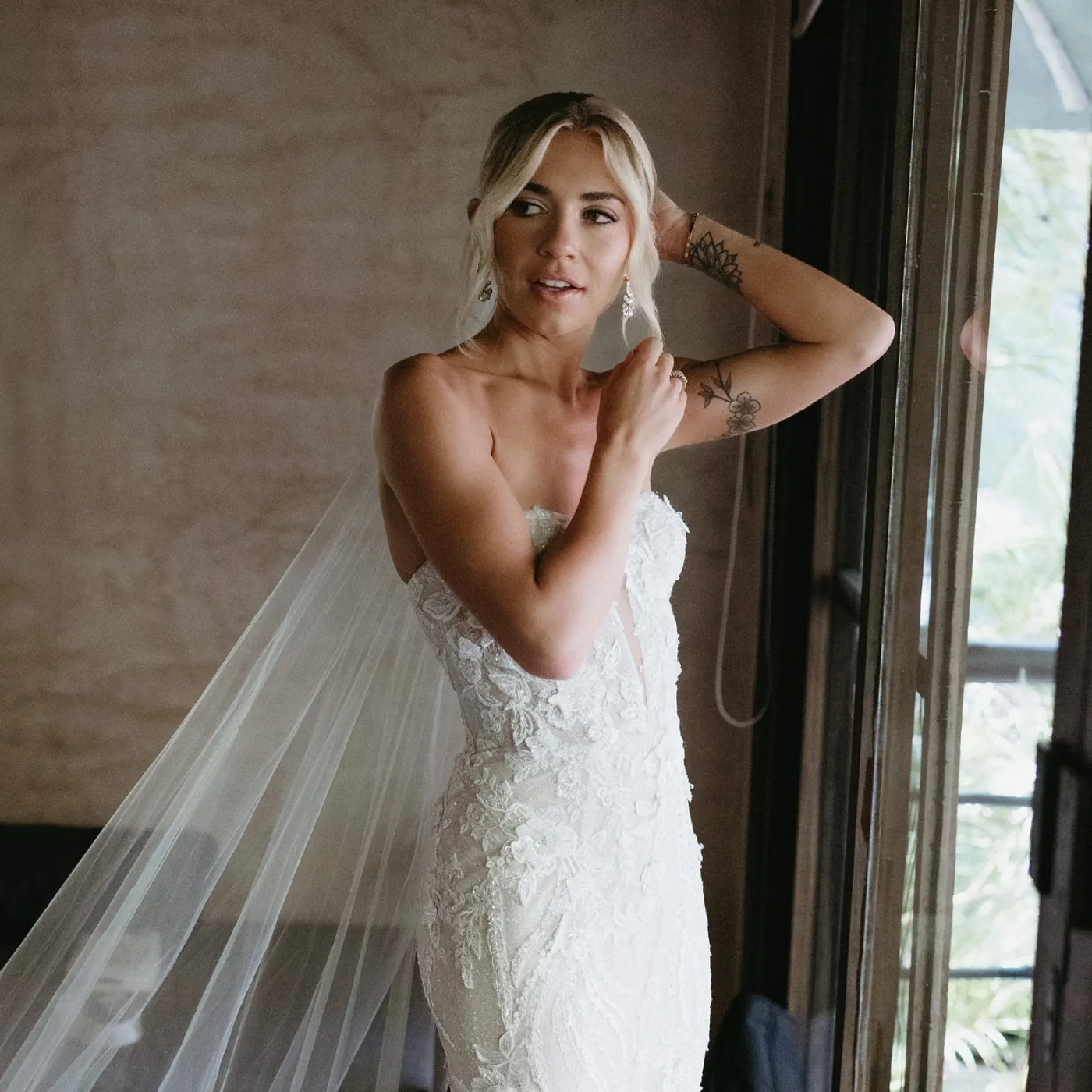 Bride in a strapless lace gown and cathedral veil