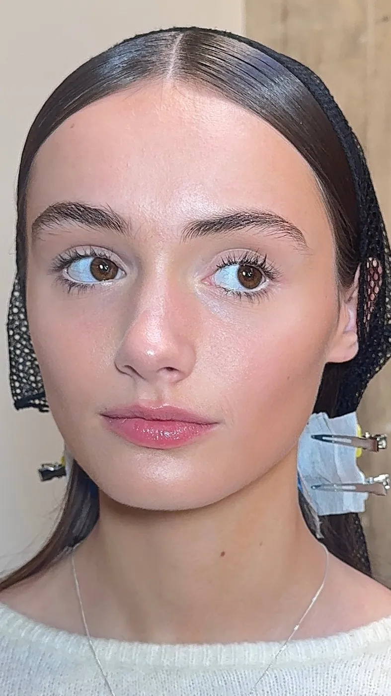 Fresh skin and soft lashes with a black hairnet